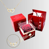 all contents of Eternal Preserved Rotating Rose Box With Engraved Necklace on grey background 